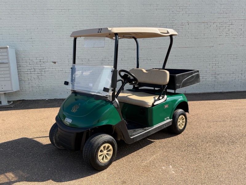 2021 E-Z-GO RXV Elite in green with tan top and rear utility cargo bed, for sale at Jane's Golf Carts in Pearl, MS