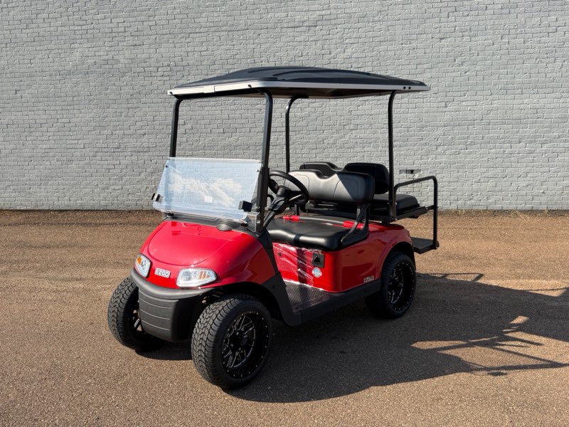 Certified pre-owned 2026 E-Z-GO RXV Elite in red with rear flip seat and black wheels, for sale at Jane's Golf Carts in Pearl, MS