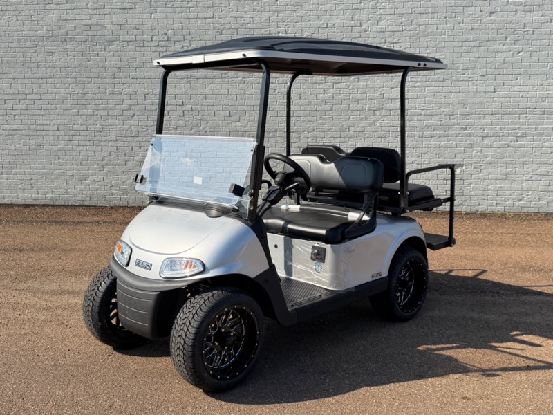 Certified pre-owned 2026 E-Z-GO RXV Elite in silver with rear flip seat and black wheels, for sale at Jane's Golf Carts in Pearl, MS