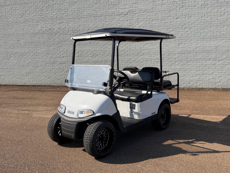 Certified pre-owned 2026 E-Z-GO RXV Elite in white with rear flip seat and black wheels, for sale at Jane's Golf Carts in Pearl, MS
