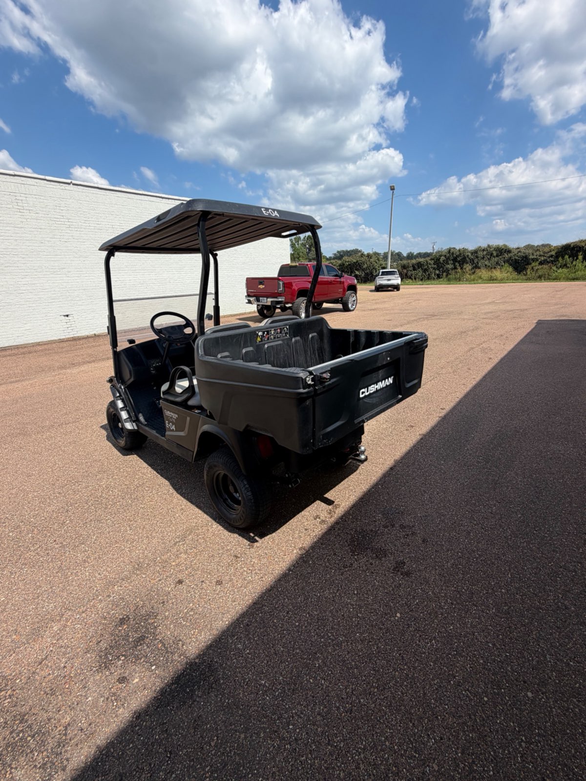 2021 Cushman Hauler 800X Elite Double Pack Electric Utility Golf Cart - Blue - Samsung Lithium Battery - rear angle with dump bed - Jane's Golf Carts Pearl MS