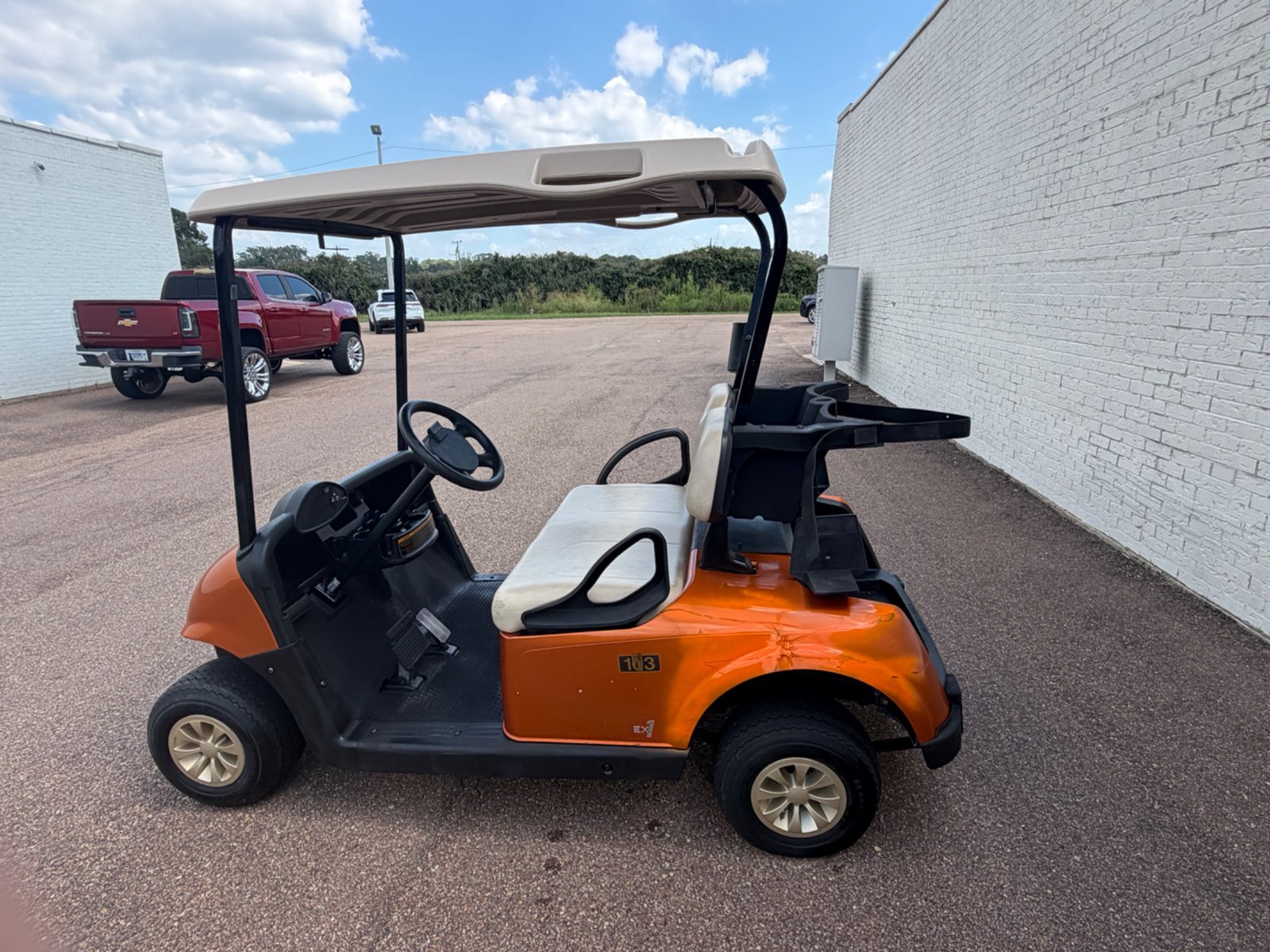 2021 E-Z-GO EX1 Gas Golf Cart - Orange - Trade-In Special - side, driver side - Jane's Golf Carts Pearl MS