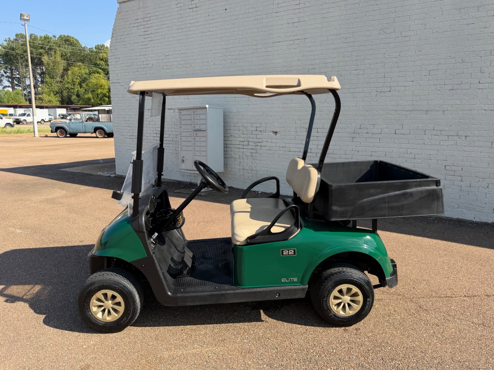 2021 E-Z-GO RXV Elite Electric Golf Cart - Green with Utility Bed - Samsung Lithium Battery - side, driver side - Jane's Golf Carts Pearl MS