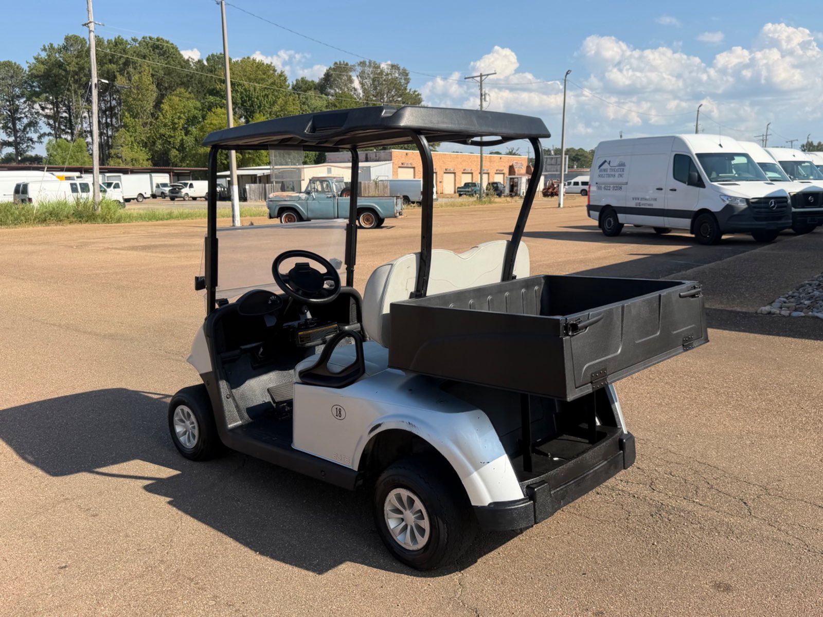 2021 E-Z-GO RXV Elite Electric Golf Cart - Silver with Utility Bed - Samsung Lithium Battery - rear angle with utility bed - Jane's Golf Carts Pearl MS