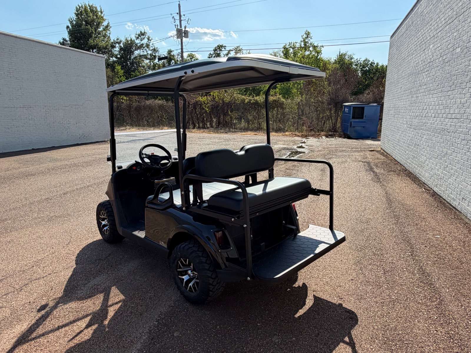 2026 E-Z-GO RXV Elite 4-Passenger Electric Golf Cart - Black - Certified Pre-Owned - Samsung Lithium Battery - rear angle, driver side - Jane's Golf Carts Pearl MS