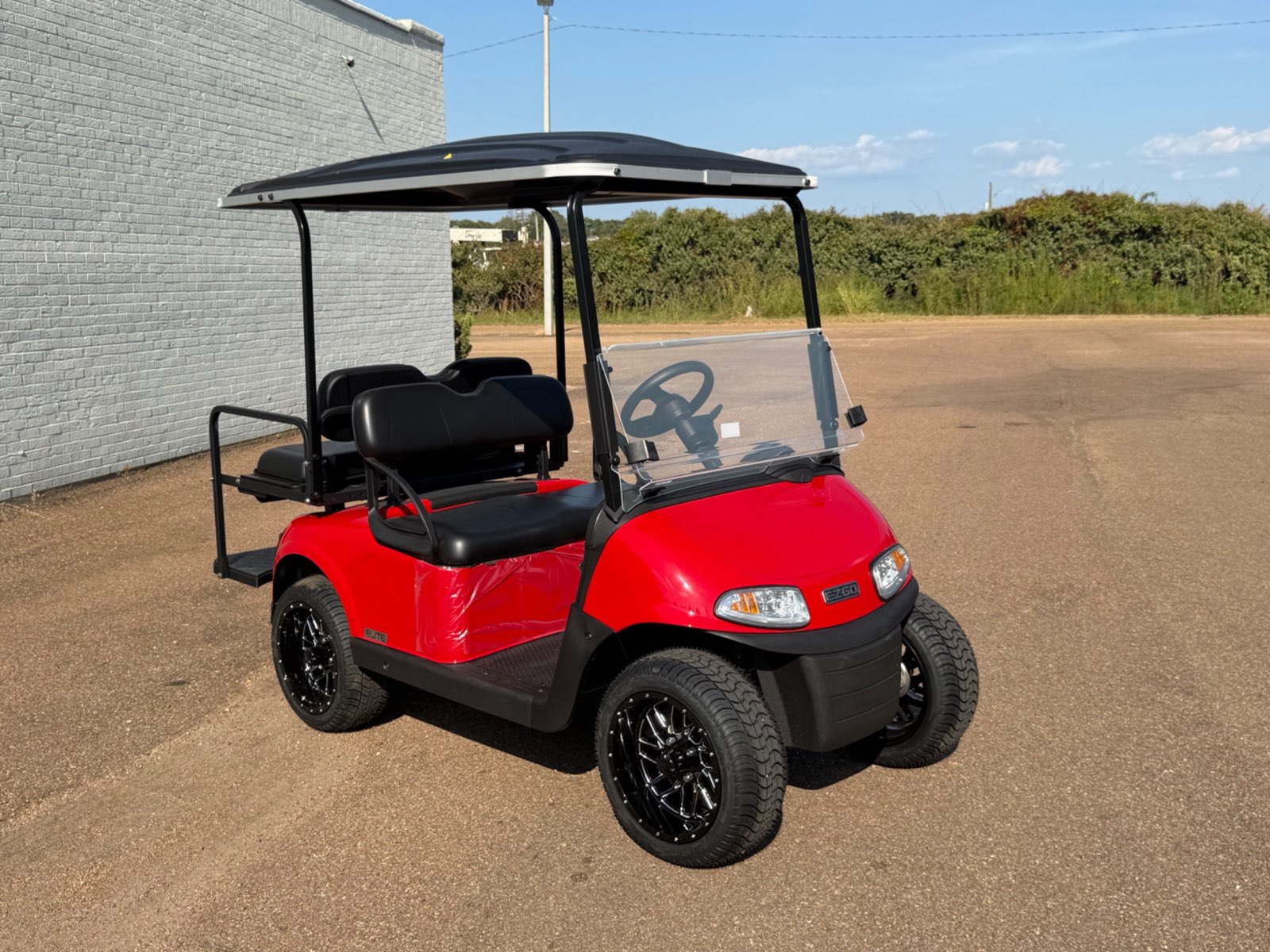 2026 E-Z-GO RXV Elite 4-Passenger Electric Golf Cart - Red - Certified Pre-Owned - Samsung Lithium Battery - front angle - Jane's Golf Carts Pearl MS