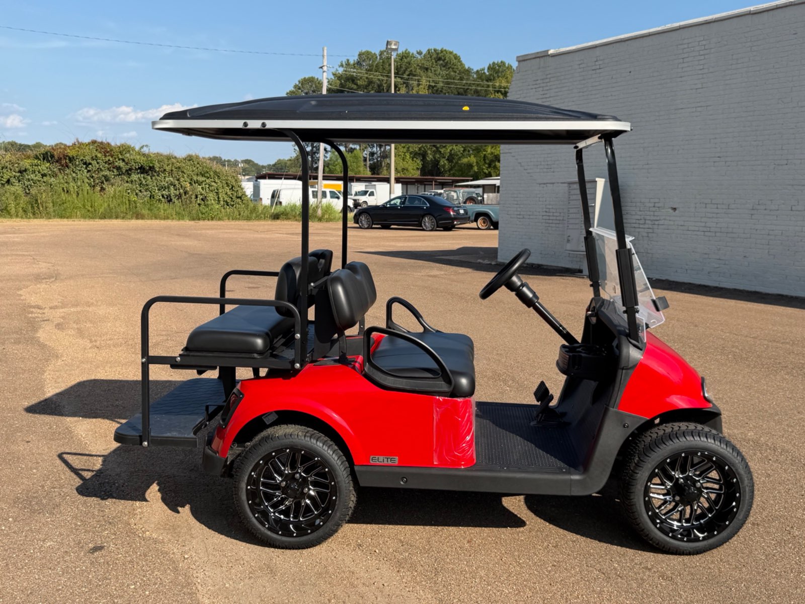2026 E-Z-GO RXV Elite 4-Passenger Electric Golf Cart - Red - Certified Pre-Owned - Samsung Lithium Battery - side - Jane's Golf Carts Pearl MS