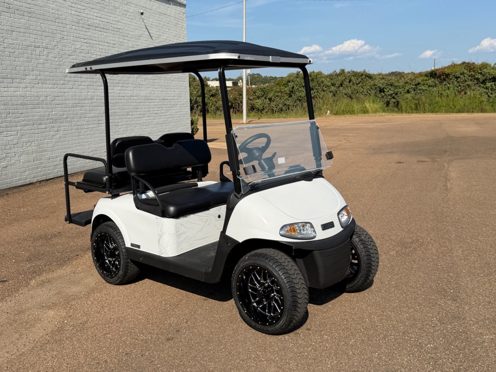 2026 E-Z-GO RXV Elite 4-Passenger Electric Golf Cart - White - Certified Pre-Owned - Samsung Lithium Battery - front angle - Jane's Golf Carts Pearl MS