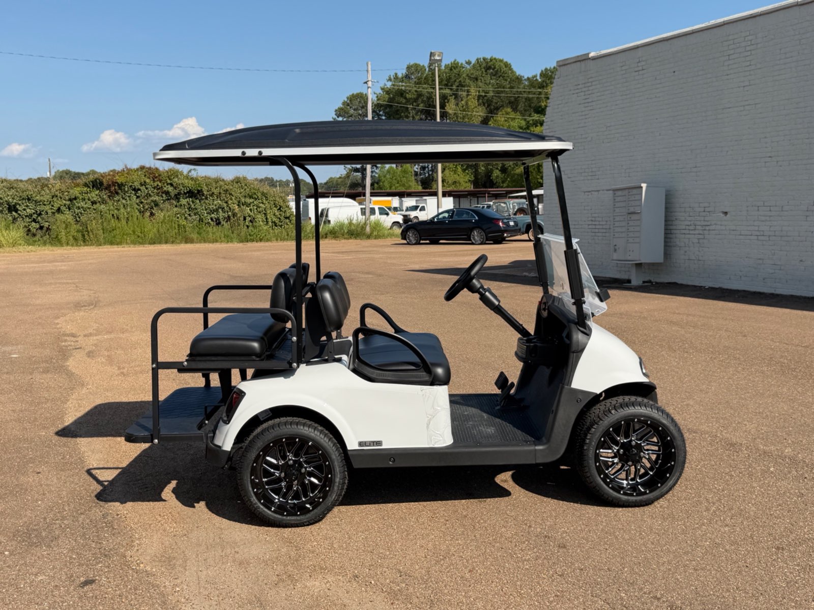 2026 E-Z-GO RXV Elite 4-Passenger Electric Golf Cart - White - Certified Pre-Owned - Samsung Lithium Battery - side - Jane's Golf Carts Pearl MS