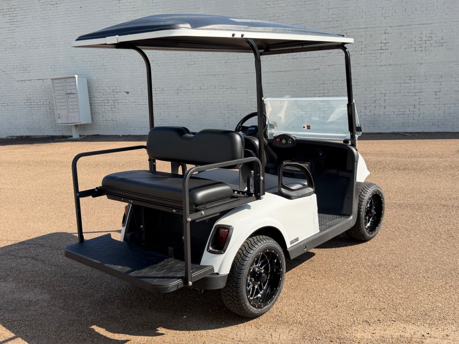 2026 E-Z-GO RXV Elite 4-Passenger Electric Golf Cart - White - Certified Pre-Owned - Samsung Lithium Battery - rear angle - Jane's Golf Carts Pearl MS